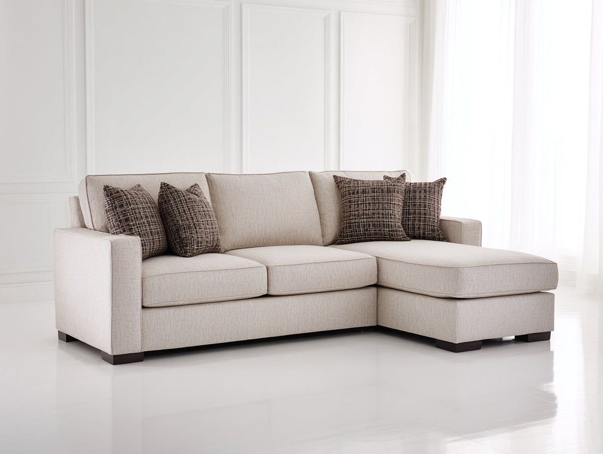 Ecksofa Stoff 250x165x85 cm - Beige - Gepolstertes Ecksofa mit breiter Ottomane im modernen Stil